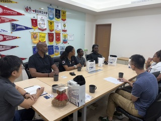 Dr. Brian S. Maiden facilitating a leadership discussion around a conference table