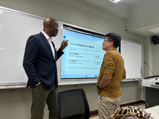 Dr. Brian S. Maiden teaching a leadership seminar to international students